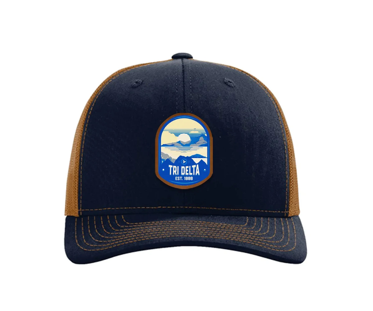 Tri Delta Richardson 112 UV Print Leatherette Patch Trucker Hat - Ventura Navy Caramel Trucker Hat